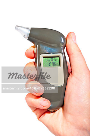 Breathalyzer in a female hand showing drunkenness