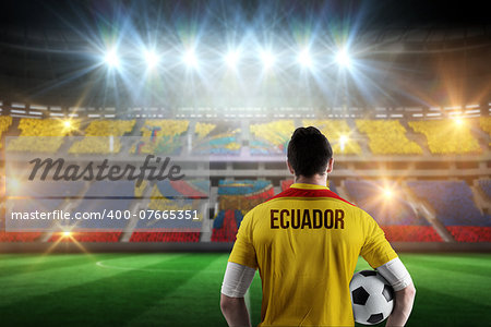Ecuador football player holding ball against stadium full of ecuador football fans