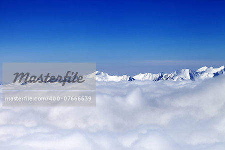 Cloudy mountains at nice day. Caucasus Mountains, Georgia, ski resort Gudauri.