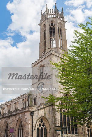 Old medieval All Saints church in English city of York with clock and octagonal lantern tower