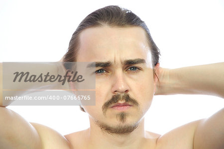 Attractive man  with arms behind his head isolated