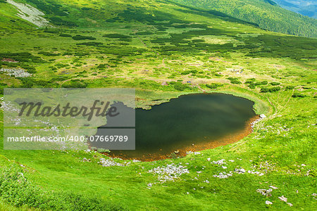 Image of a beautiful mountain lake in carpathian mountains. Chornohora massif in eastern Carpathians.