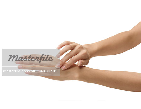 Beauty shot of woman's hands with french manicure, studio shot on white background Beauty shot of woman's hands with french manicure, studio shot on white background