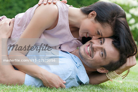 Portrait of loving young couple enjoying together in park