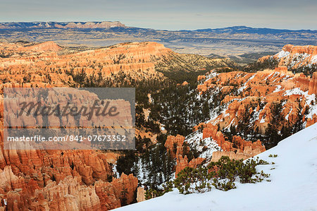 Hoodoos, cliffs, vegetation and distant view with snow, Inspiration Point, Bryce Canyon National Park, Utah, United States of America, North America