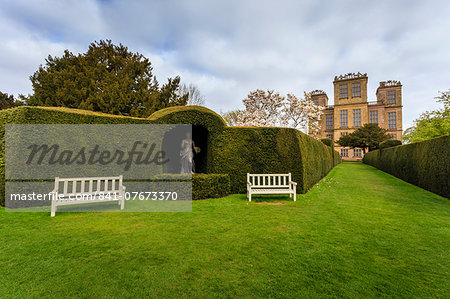 Yew hedge, seats and sculpture in spring at Hardwick Hall, near Chesterfield, Derbyshire, England, United Kingdom, Europe
