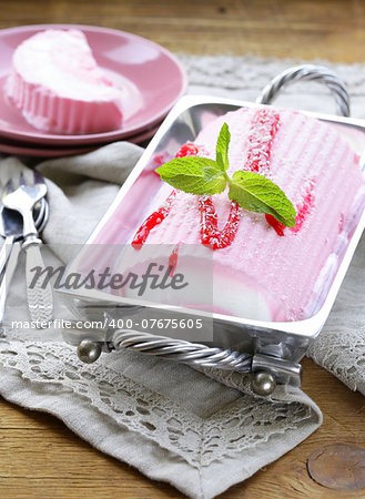 strawberry vanilla cake roll ice cream with mint and berry sauce