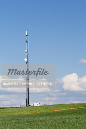 communications tower in the field and sky