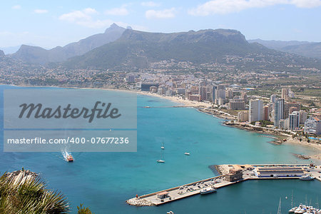 Panoramic view over Calp (Spain). Town bay beach