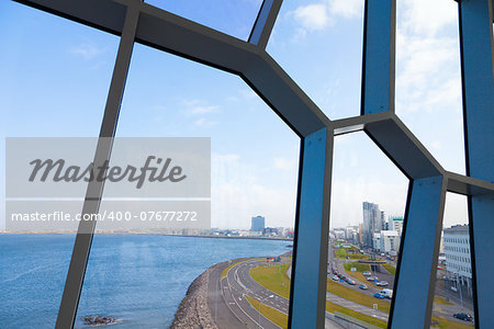 A view to Reykjavik coastline through the windows of Harpa Concert Hall