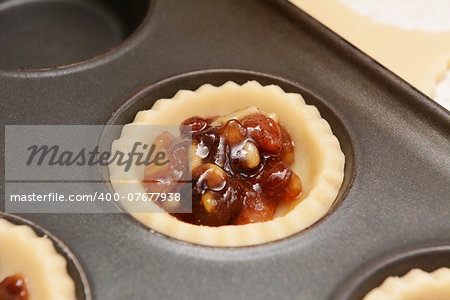 Close up of traditional mincemeat in pastry shell to make a mince pie