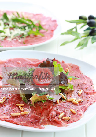 Beef carpaccio with rucola and pine nuts