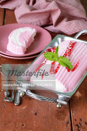 strawberry vanilla cake roll ice cream with mint and berry sauce