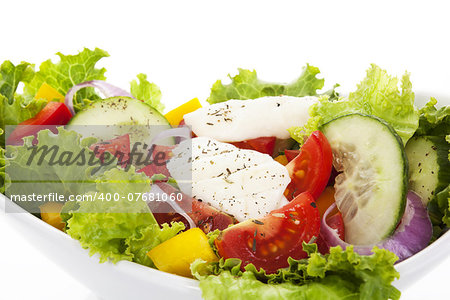 Delicious fresh colorful salad isolated on white background. Healthy light and diet summer eating.