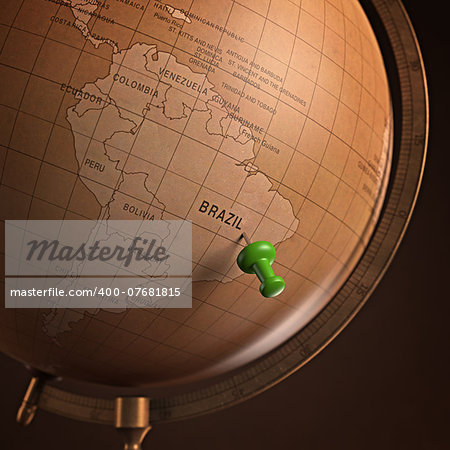 Antique globe with the Brazil marked by the pin. Clipping path included.