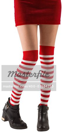 Santa girl wearing stripey socks on white background