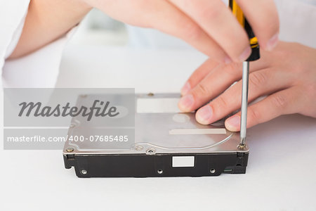 Technician working on broken hardware in his office