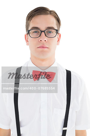 Nerdy hipster looking at camera  on white background