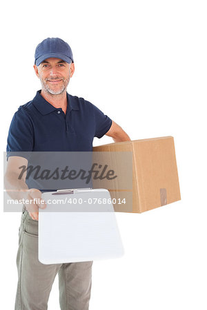 Happy delivery man holding cardboard box and clipboard on white background