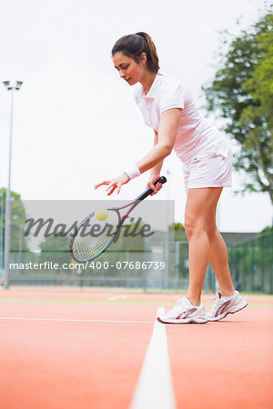 Tennis player playing a match on the court on a sunny day