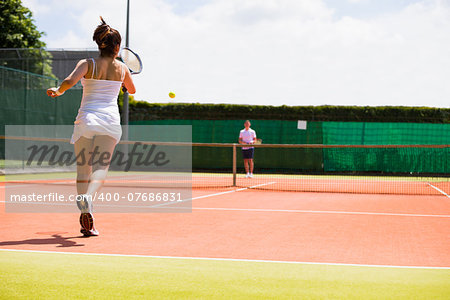 Tennis match in progress on the court on a sunny day