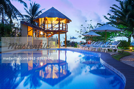 South America, Brazil, Alagoas, Praia do Riacho, sun loungers around the pool at the Pousada Riacho Dos Milagres boutique hotel PR