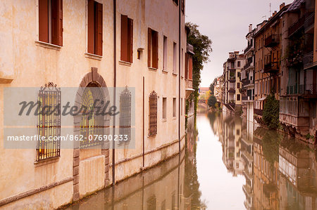 Italy, Veneto, Padua. A canal crossing the city centre.