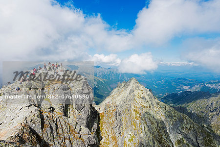 Europe, Poland, Carpathian Mountains, Zakopane, hikers on summit of Mt Rysy, 2499m highest point in Poland