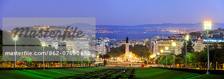 The panorama from the Eduardo VII Park at twilight. Marques de Pombal square and the Tagus river on the horizon. Lisbon, Portugal