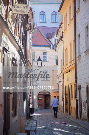 Man walking along street in Old Town, Bratislava, Slovakia