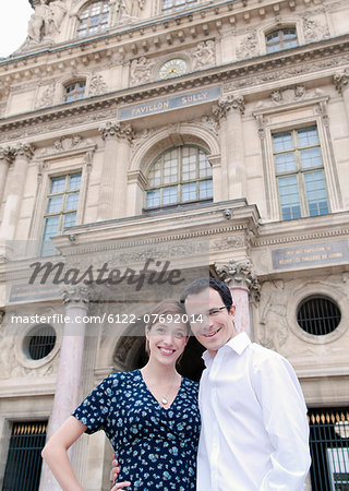 Happy couple outside the Louvre Paris