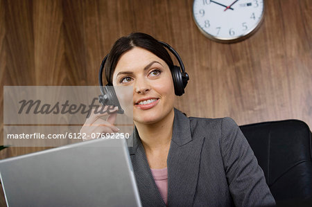Business woman on telephone headset