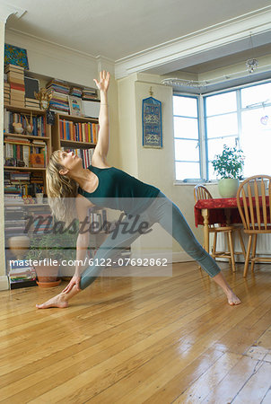 Woman stretching at home