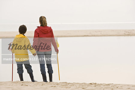 Mother and son on beach with fishing net