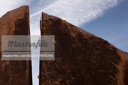 Split rock with blue sky