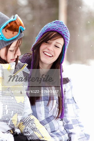 Teen girls in snowboard clothing