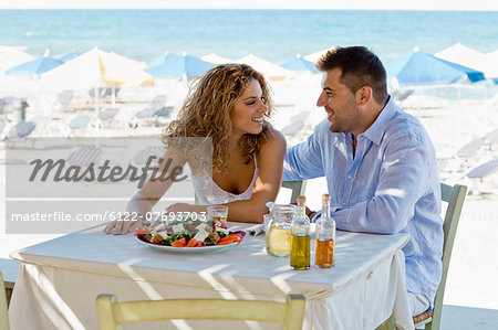 couple having lunch near the beach
