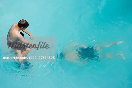 Boys playing in swimming pool, Auckland