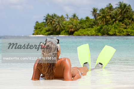 Female snorkeler, Medahutthaa Island, North Huvadhu Atoll, Maldives