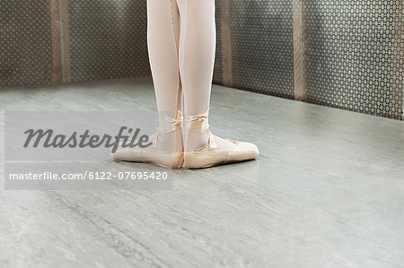 Feet of ballerina in first position