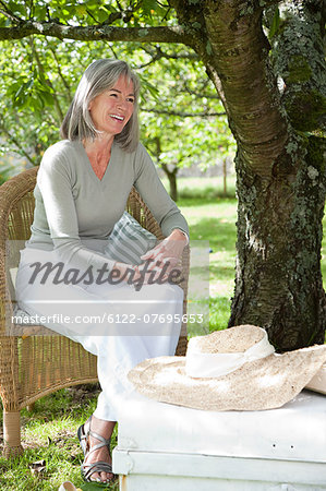 Mature woman sitting on chair