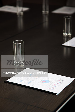 Conference table with drinking glasses and documents