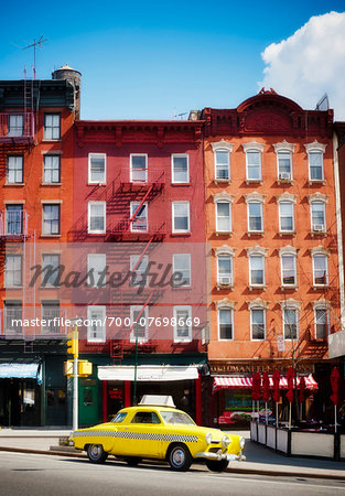 Traditional red brick buildings and old car in the trendy Chelsea district, Manhattan, New York City, NY, USA Traditional red brick buildings and old car in the trendy Chelsea district, Manhattan, New York City, NY, USA