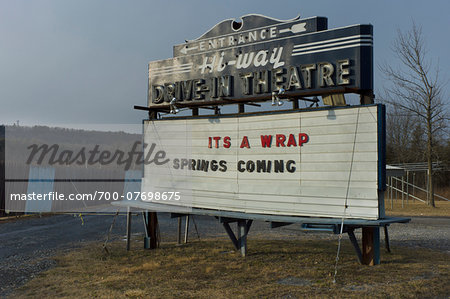 Drive-in Theatre board, closed during winter, along road in Catskills area, New York, USA