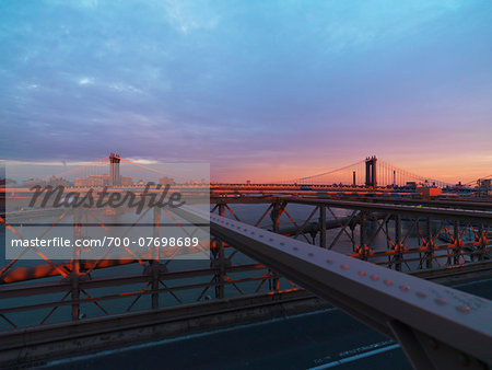 View of Manhattan Bridge from Brooklyn Bridge at sunset in winter, New York City, New York, USA