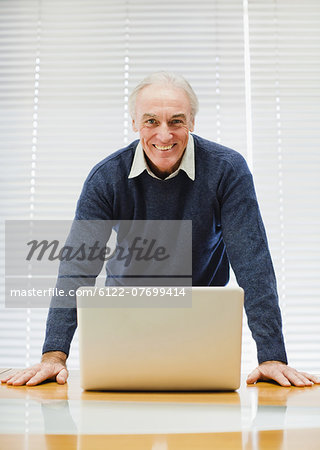 Businessman at laptop in office