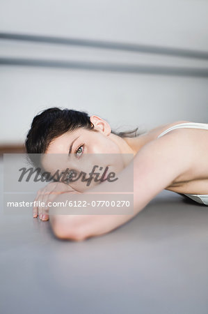 Ballet dancer on floor in studio