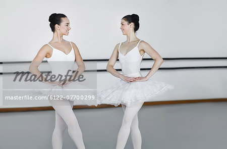 Ballet dancers posing together in studio
