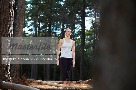 Woman walking in forest