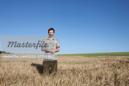 Man standing in wheat field